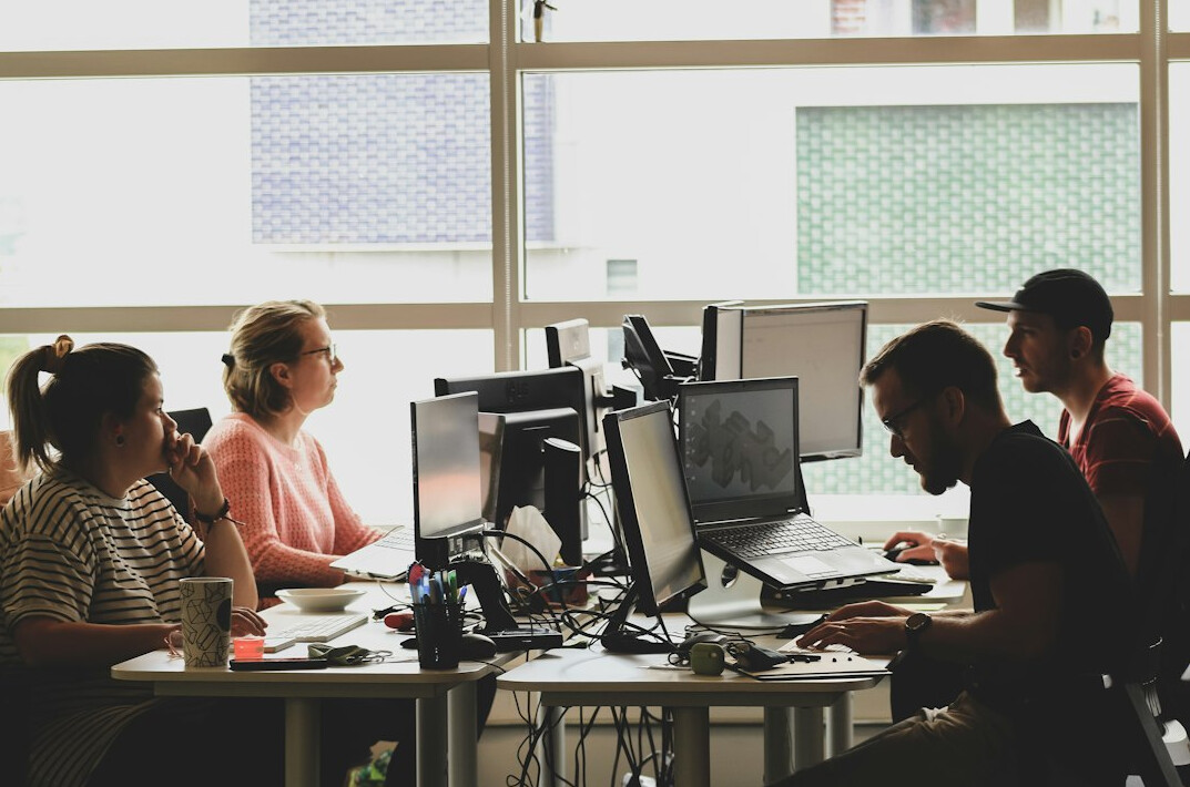 programmers developing insurance software